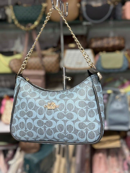 SIGNATURE SLING BAG
